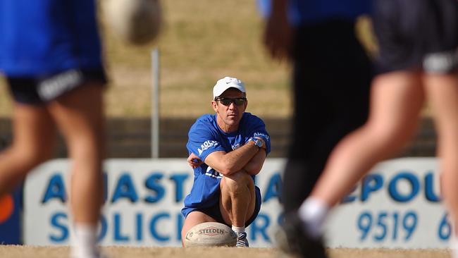 SYDNEY — AUGUST 21: Bulldogs coach Steve Folkes watches on during the Bulldogs training session held at Belmore Sportsground, Sydney, Australia on August 21, 2002. The bulldogs trained despite the chance they might be expelled from the NRL competition after it was found they breached the NRL's salary cap limit. (Photo by Chris McGrath/Getty Images)