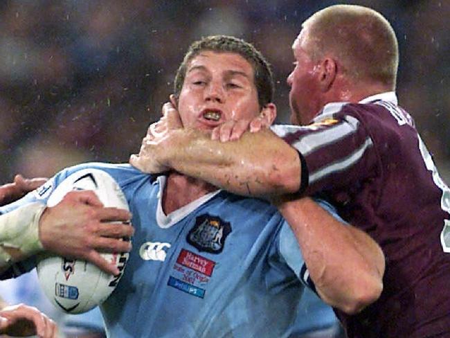 JUNE 10, 2001 : Bryan Fletcher (ball) tackled by Chris Beattie (top) during NSW V Queensland State Of Origin Game 2 at Stadium Australia,in Homebush, Sydney, 10/06/01. Pic Brett Faulkner.Rugby League A/CT