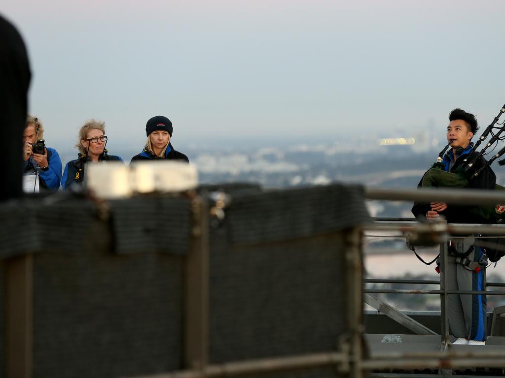 A dawn service was held on the summit of the Sydney Harbour Bridge to commemorate ANZAC Day. Money raised by the members of the public who climbed the bridge went to RSL DefenceCare. Bagpiper Ricky Keung. Picture: Toby Zerna