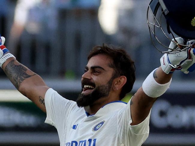 India's Virat Kohli celebrates reaching his century (100 runs) during day three of the first Test cricket match between Australia and India at Optus Stadium in Perth on November 24, 2024. (Photo by COLIN MURTY / AFP) / -- IMAGE RESTRICTED TO EDITORIAL USE - STRICTLY NO COMMERCIAL USE --