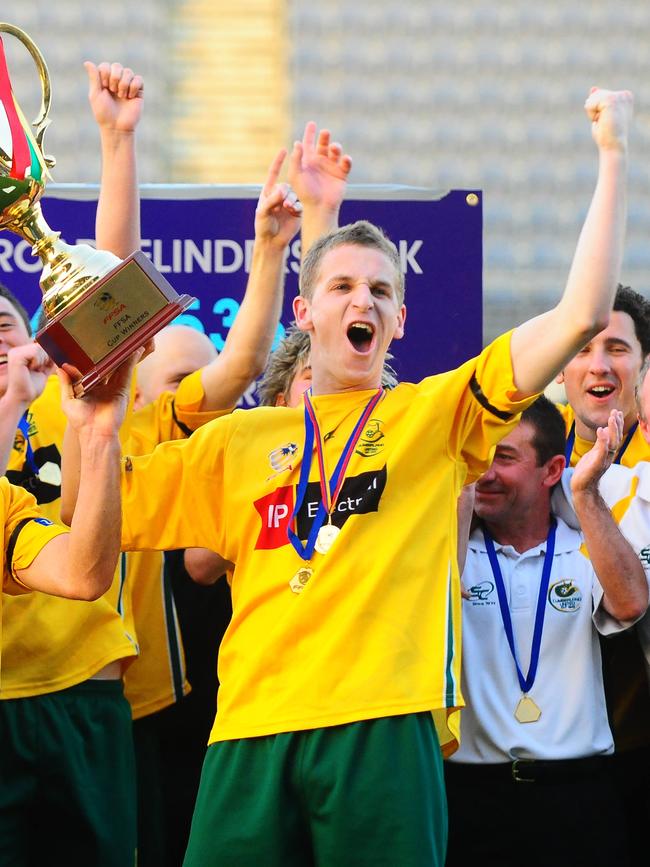 Robby Lippett lifts the FFSA Cup in 2009.