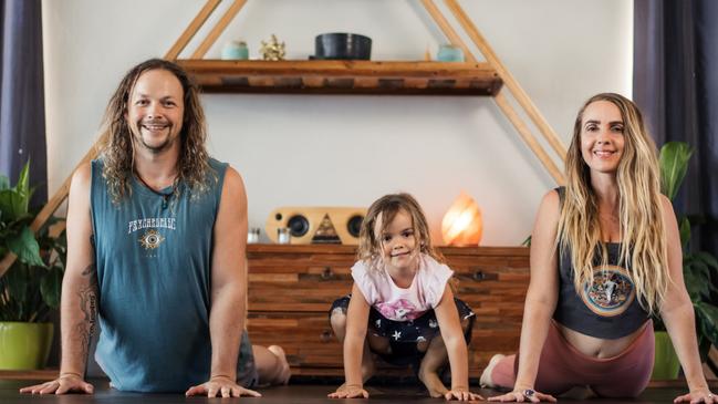 Wild Heart Yoga Tribe studio owners Jay Horton and Kylie Bertram with their daughter Savannah. Picture: Supplied.