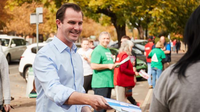 James Stevens hands out how to vote cards at Norwood Primary School on election day. Picture: Matt Loxton