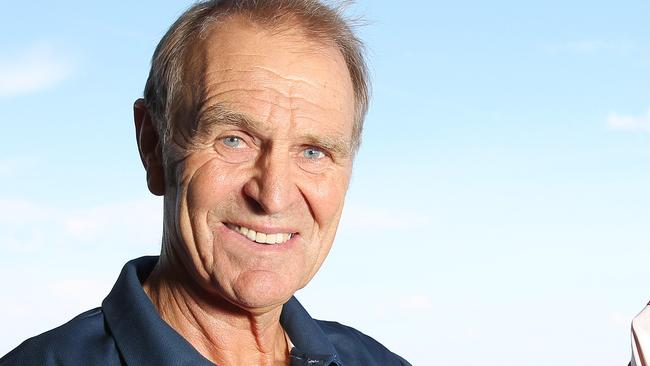 Graham Cornes is returning to coach South Australia. Graham with the South Australian Football guernsey, at his home in Glenelg South. Picture: Stephen Laffer