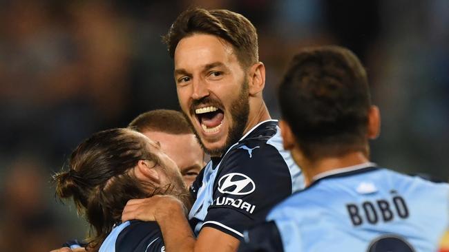 Sydney FC’s Milos Ninkovic celebrates his goal against the Newcastle Jets on Saturday night.