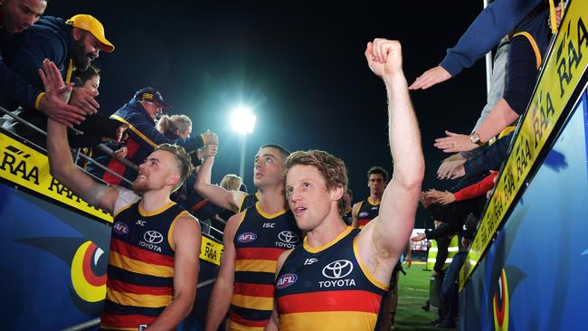 Rory Sloane celebrates with Crows teammates after the match. Picture: Daniel Kalisz/Getty Images