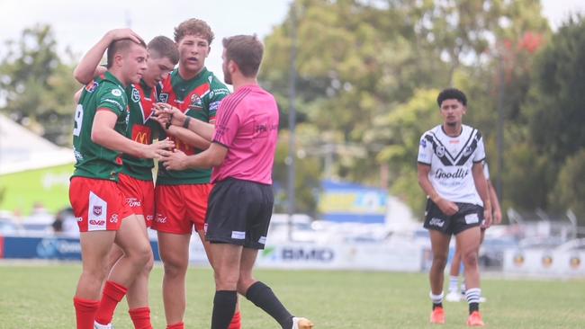 Wynnum Manly captain Ezekiel Jones, left, congratulates a try scorer.