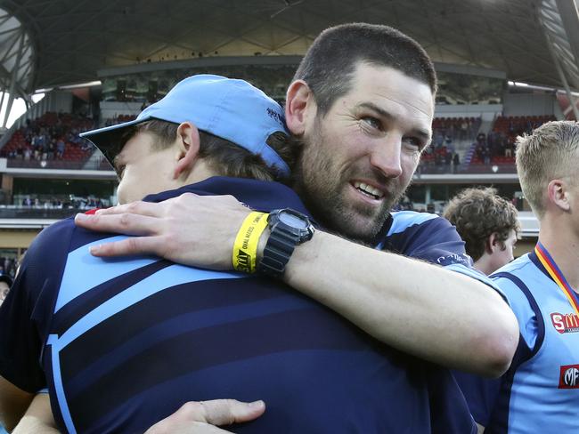 SANFL - Grand Final - Port Adelaide v Sturt at Adelaide Oval. Sturt coach Martin Mattner hugs his players after the win.  Picture Sarah Reed