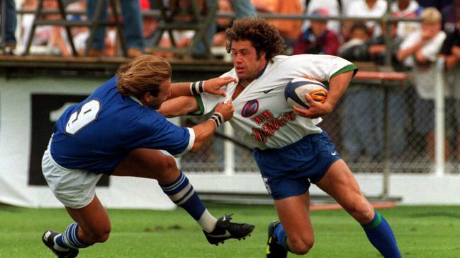 Auckland Warriors' former All Black Mark Ellis tries to fend off Andy Marinos during Super League trial at Lancaster Park, Christchurch in 1996