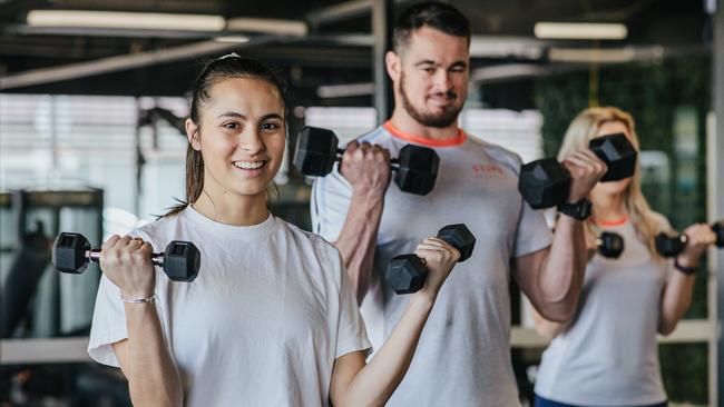 Gym member Emilie Nation with Lismore Stepz staff Will Bugden and Alyce Benson. Picture: Stepz Fitness