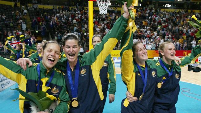 Alex Hodge with Kathryn Harby-Williams. Peta Squire and Sharelle McMahon proudly displaying their gold medals.