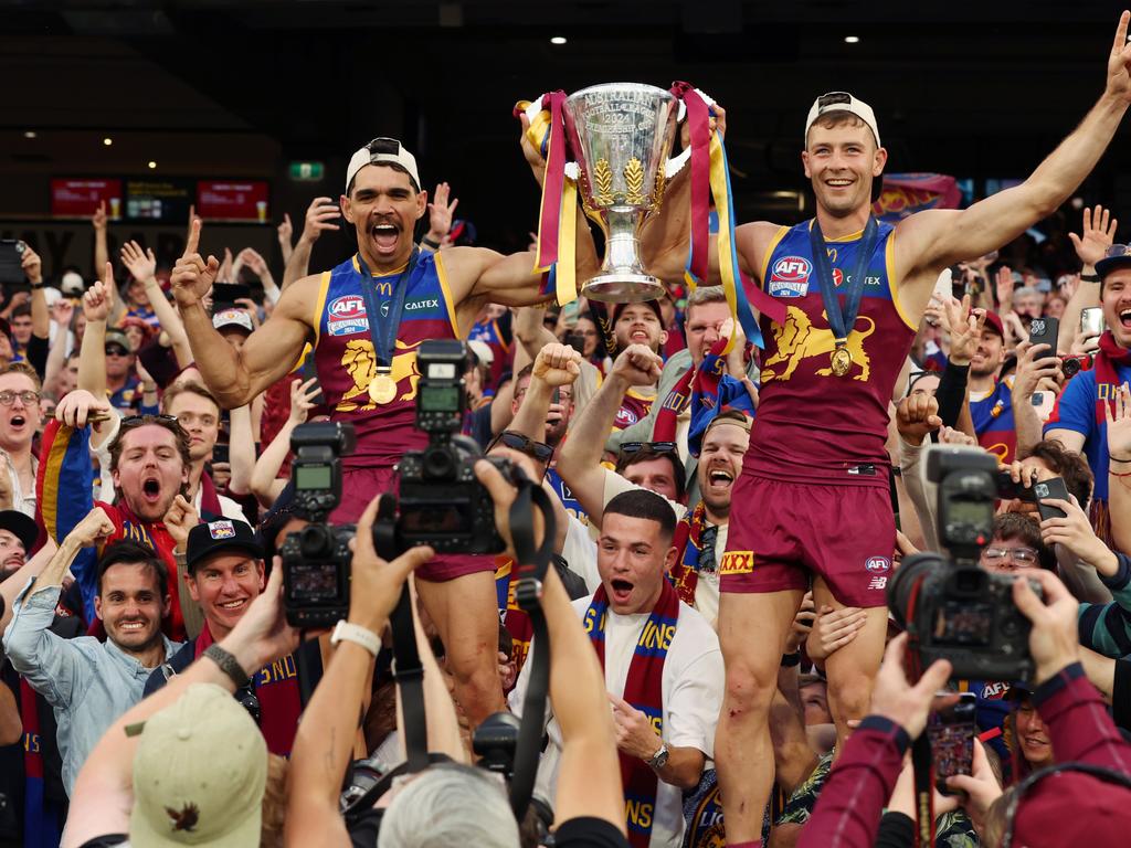 Brisbane Lions players celebrate winning the AFL Grand Final after defeating the Sydney Swans at the MCG. Picture Lachie Millard