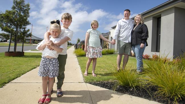 Paul and Aimee Wheate with their kids, Beatrix, 4, Myles, 7, and Eliana, 10, at their house in Armstrong Creek outside of Geelong. Picture: David Geraghty