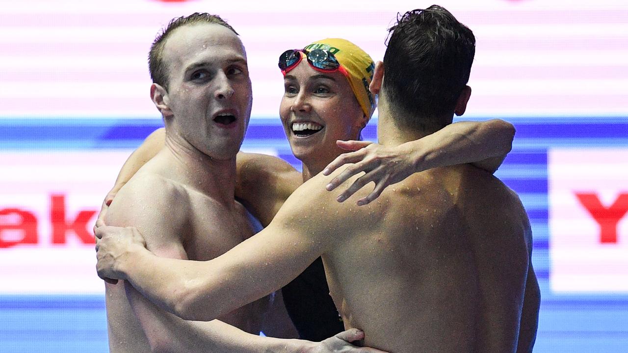 Australia's Mitchell Larkin, Australia's Matthew Wilson Australia's Emma McKeon react after taking gold in the final of the mixed 4x100m medley in 2019. (Photo by Oli SCARFF / AFP)