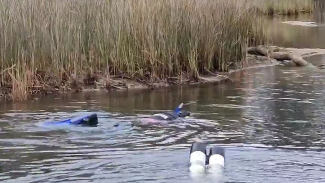 Police divers scour the waters around St Helens for anything that could help the case.