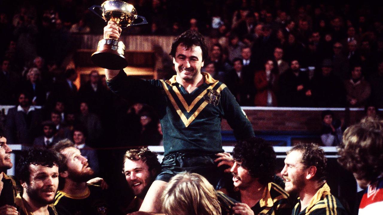 Max Krillich holds up a trophy for the 1982 Kangaroos.