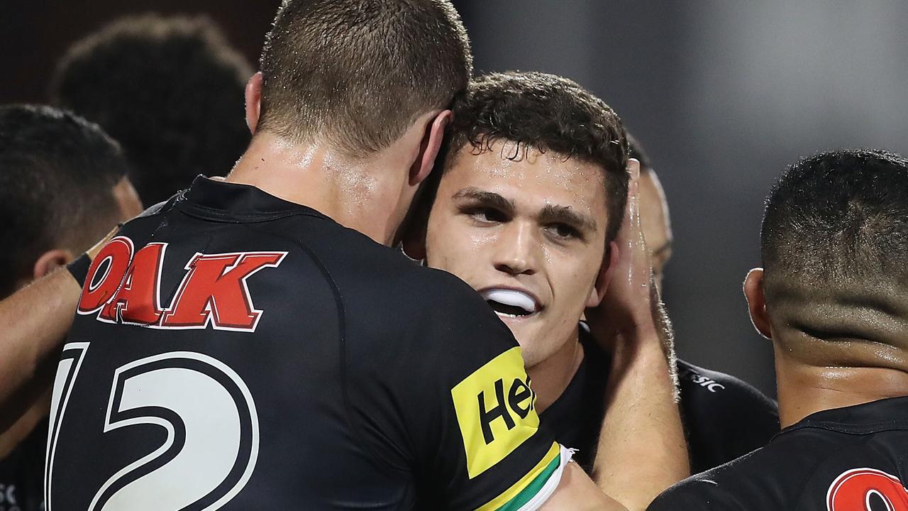 Nathan Cleary is congratulated by teammates after scoring a try.