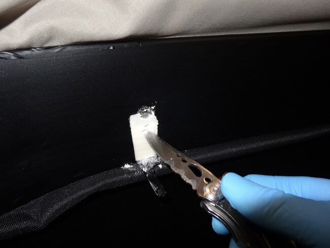 Cocaine concealed within luggage