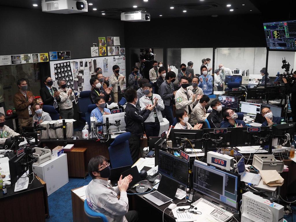 Hayabusa2 project members in the mission control room watched via livestream as the re-entry capsule descended into a fireball before landing in South Australia. (Picture: Yutaka IIJIMA / JAXA / AFP)