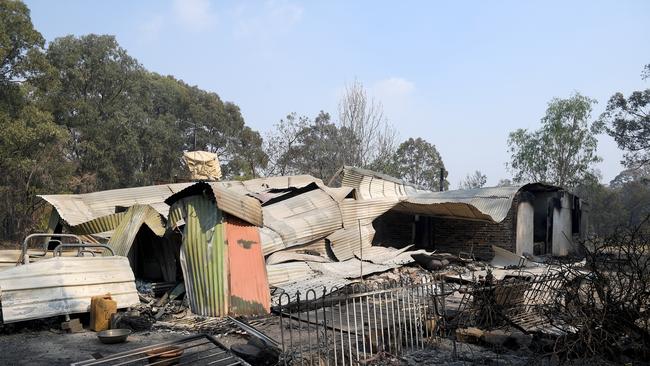 A property is destroyed by fire near Colo Heights, north west of Sydney on Saturday.