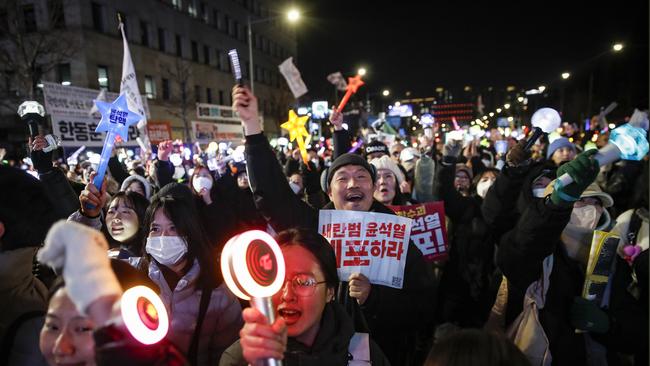 Protesters celebrate in South Korea. Picture: Woohae Cho/Getty Images