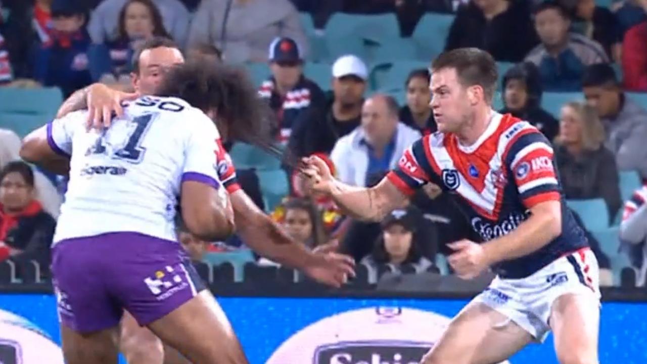 Luke Keary grabs a handful of hair from Felise Kaufusi, and then collects him across the chin with a swinging arm.