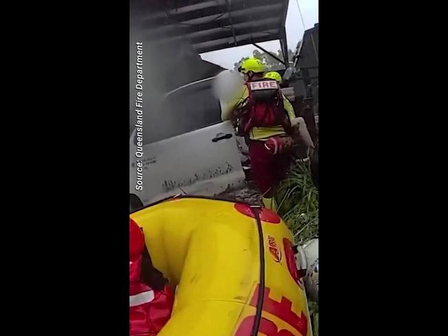 Qld fire department rescue person trapped in floods