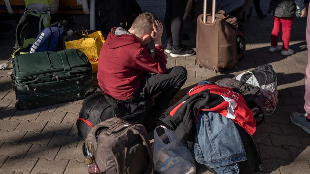 Ukrainian evacuees wait to board a train to Warsaw at the rail station in Przemysl, near the Polish-Ukrainian border. Picture: Angelos Tzortzinis / AFP