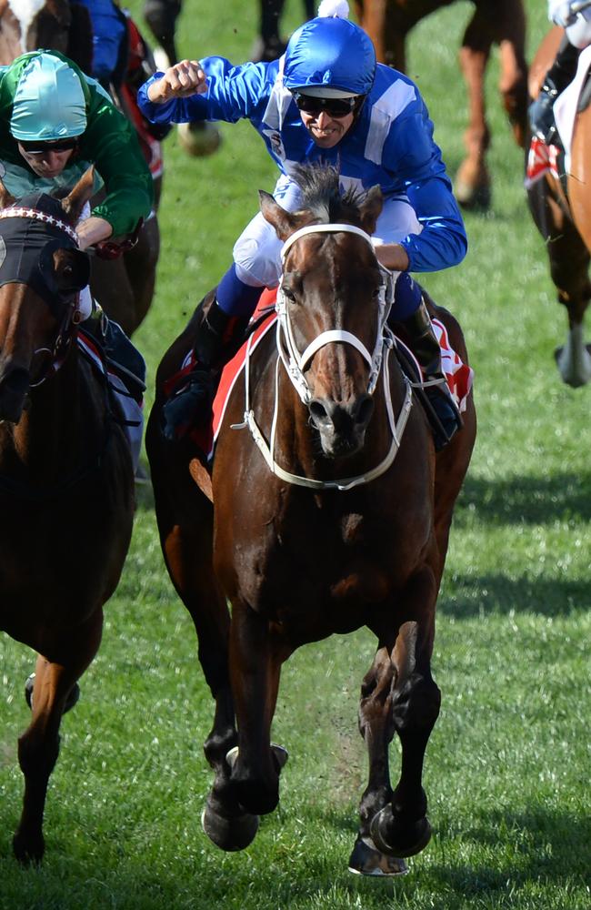 Racing into history ... again: Winx ridden by Hugh Bowman takes out her third successive Cox Plate. Picture: Mal Fairclough/AAP