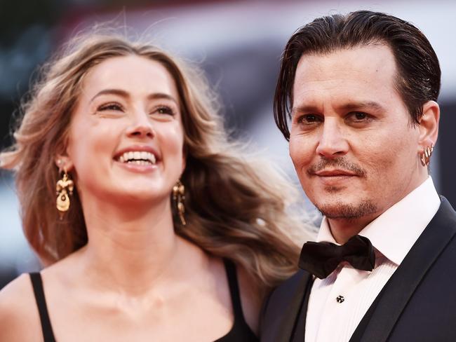 Johnny Depp with his ex-wife Amber Heard. The couple divorced acrimoniously after just 15 months of marriage. Picture: Ian Gavan/Getty Images