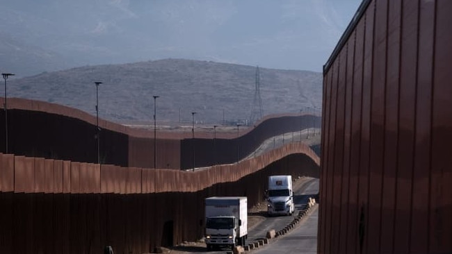 Trucks head from Mexico to cross the border into the U.S. Mexico says a 25 per cent duty on Mexican goods would have a multibillion-dollar impact and affect millions of US households Picture: Guillermo Arias/AFP/Getty Images