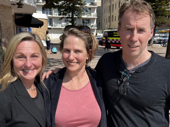 Katherine Smith (centre), of Kurraba Point, reunited on Tuesday, with Melissa Pye, of Neutral Bay, and Peter Ingle, of Balgowlah Heights, who helped rescue her from the water off Manly Beach, on July 29. Picture: NSW Ambulance