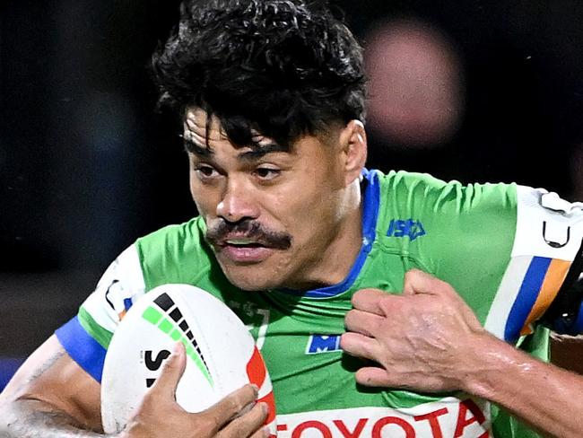 BRISBANE, AUSTRALIA - JUNE 01: Matt Timoko of the Raiders attempts to break away from the defence of Herbie Farnworth of the Dolphins during the round 13 NRL match between Dolphins and Canberra Raiders at Suncorp Stadium, on June 01, 2024, in Brisbane, Australia. (Photo by Bradley Kanaris/Getty Images)