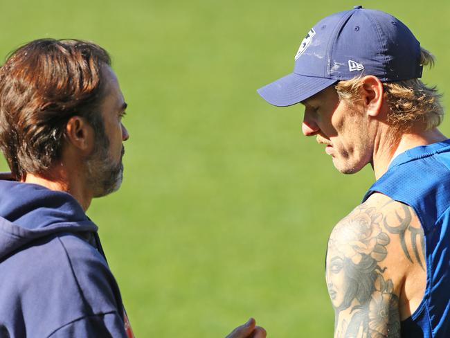 Coach Chris Scott speaking to Tom Stewart at Cats training. Picture: Alison Wynd