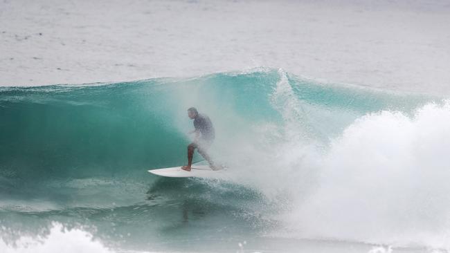 Surfers at Snapper Rocks and Kirra riding the Large swell produced by Cyclone OMA. Photograph : Jason O'Brien