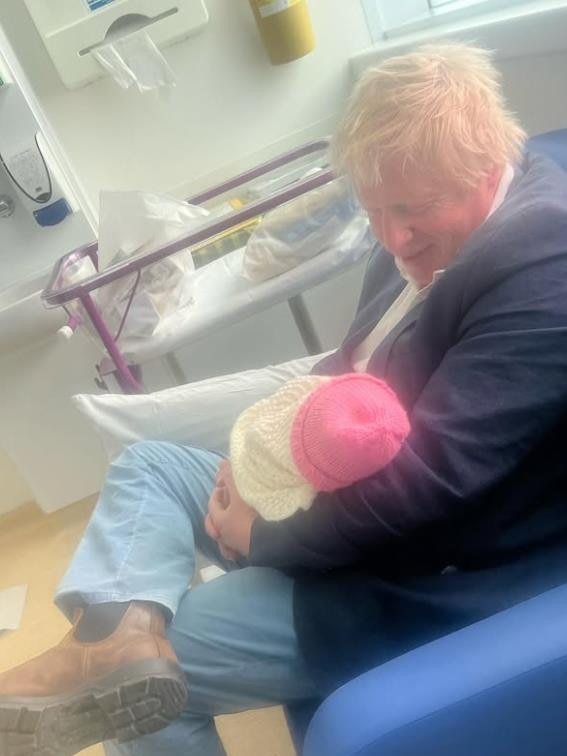 Boris Johnson with his newborn daughter. Picture: Carrie Johnson/Instagram