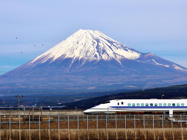 ESCAPE: TOKYO COVER OPTION  .. A bullet train passes below Mt. Fuji in Japan. Picture: iStock