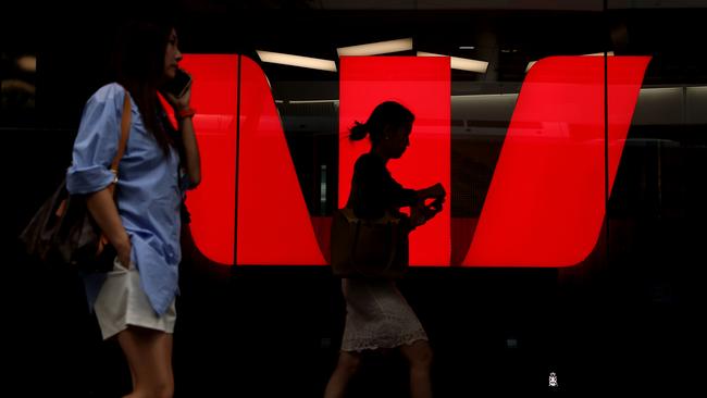 SYDNEY, AUSTRALIA - MARCH 27: Pedestrians walk past Westpac Banking Corp. logo at Westpac Place building on March 27, 2024 in Sydney, Australia. In the last quarter, Westpac Bank reported a quarterly cash profit of A$1.8 billion, meeting consensus expectations, while NAB experienced a 17% decline in first-quarter cash profit compared to the previous corresponding period, reflecting varying performances among the major Australian banks. (Photo by Brendon Thorne/Getty Images) (Photo by Brendon Thorne/Getty Images)