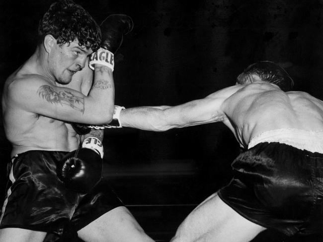 Tommy Collins (left) in action in the boxing ring in 1959.