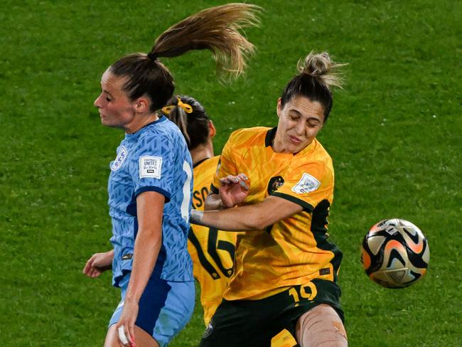 England goalscorer Ella Toone clashes with Australian midfielder Katrina Gorry. Picture: Saeed Khan/AFP)