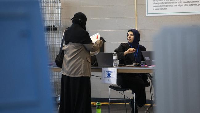 A Michigan Muslim American casts her vote at in Tuesday’s US election. Picture: Getty