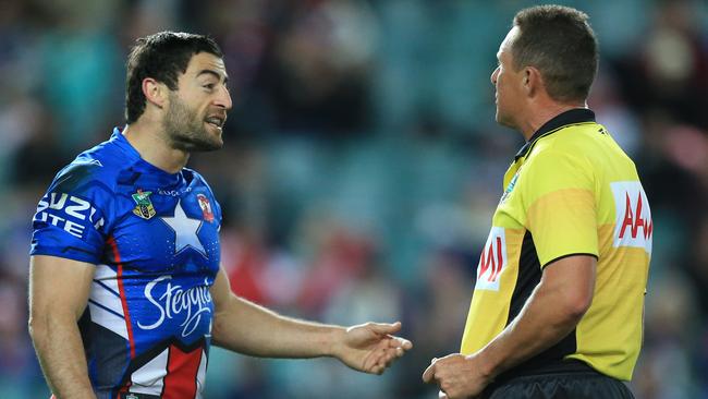 Anthony Minichiello argues with referee Shayne Hayne over a quick tap from which the Dragons scored.