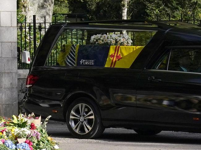 The hearse carrying the coffin of Queen Elizabeth II, with the firm’s ad, leaving Balmoral as it begins its journey to Edinburgh. Picture: Getty Images.