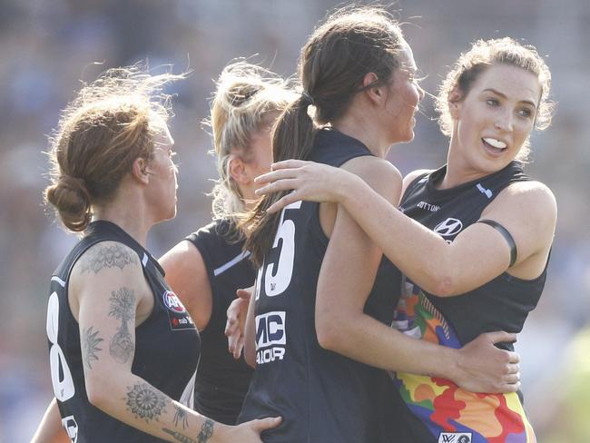 Chloe Dalton of the Blues (second right) celebrates a goal with teammates during the Round 7 match between the Western Bulldogs and the Carlton Blues at Victoria University Whitten Oval in Melbourne, Sunday, March 17, 2019. (AAP Image/Daniel Pockett) NO ARCHIVING, EDITORIAL USE ONLY