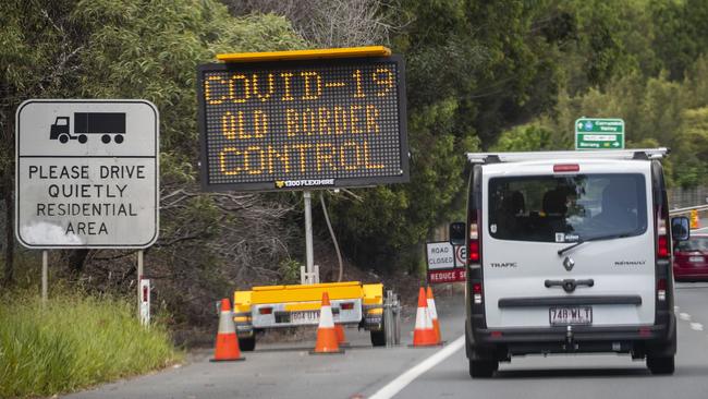 A COVID-19 border control road sign on an overpass on the M1 at Coolangatta. Picture: Glenn Hunt