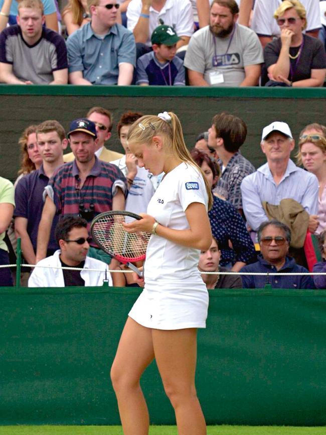 On court at the 2000 Wimbledon championships as her family (top right) looks on. (Pic: Getty Images)