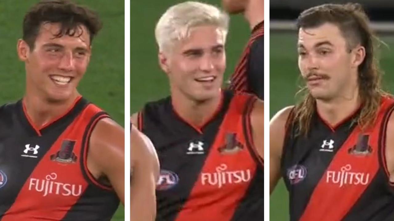 Essendon players smiling on the final siren against Fremantle.