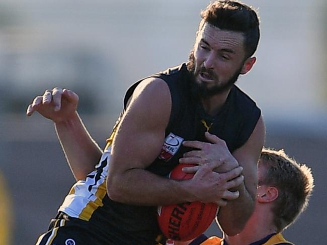 Balwyn's Dylan Collis takes a mark during the EFL football match between Balwyn and Vermont in Balwyn, Saturday, June 2, 2018.  Picture: Andy Brownbill