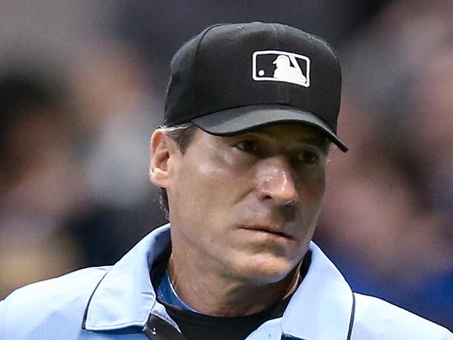 MILWAUKEE, WISCONSIN - MAY 04: Umpire Angel Hernandez looks on during the game between the New York Mets and Milwaukee Brewers at Miller Park on May 04, 2019 in Milwaukee, Wisconsin. (Photo by Dylan Buell/Getty Images)