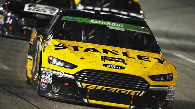 Marcos Ambrose, driver of the #9 Stanley/Ace/CMN Ford, leads a pack of cars during the NA